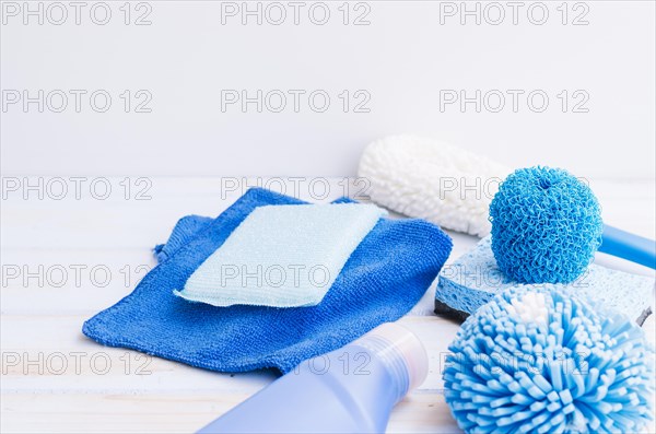 Close up blue cleaning supplies desk