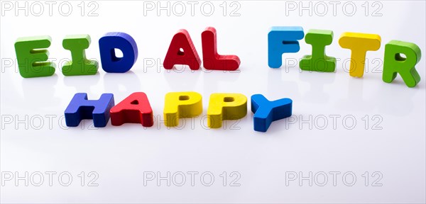 The word EID EL FITR written with colorful letter blocks