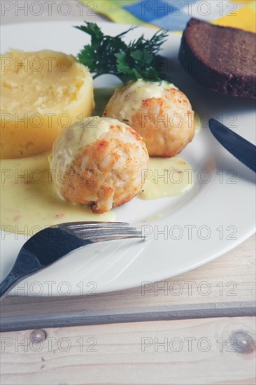 Closeup view of plate with meatballs and mashed potato