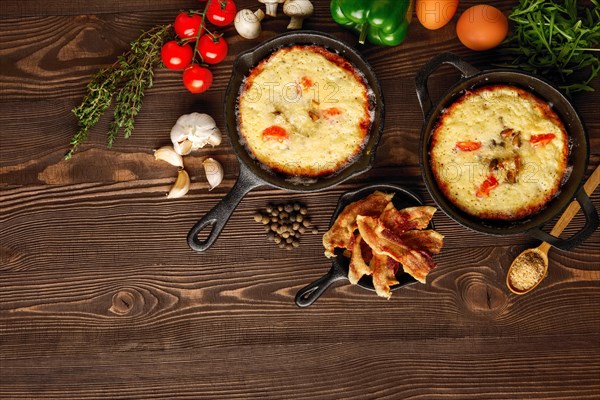 Table with cast-iron pan and spices