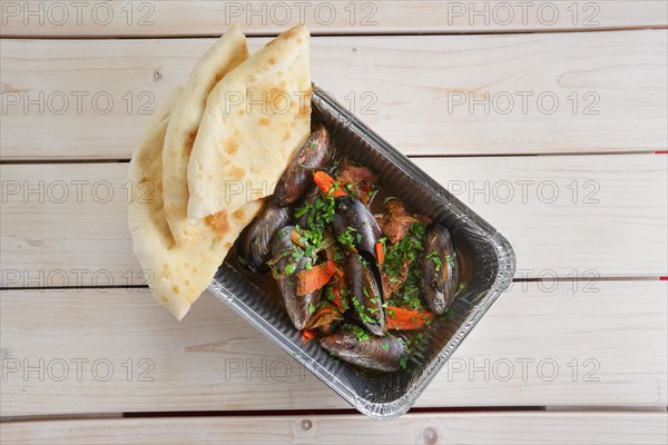 Baked oysters covered with bannock