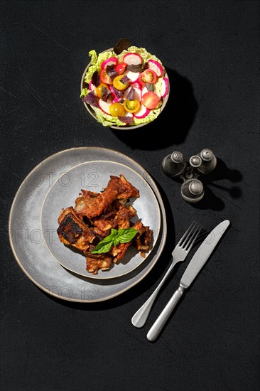 Overhead view of marinated lamb ribs baked in oven