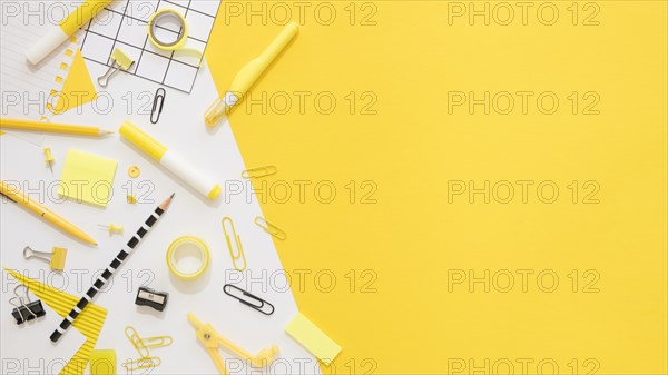 Flat lay office stationery with copy space paper clips