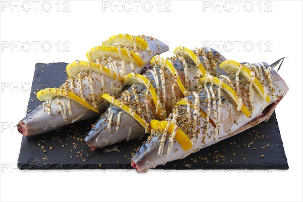 Fresh mackerel with spices and lemon ready for barbecue