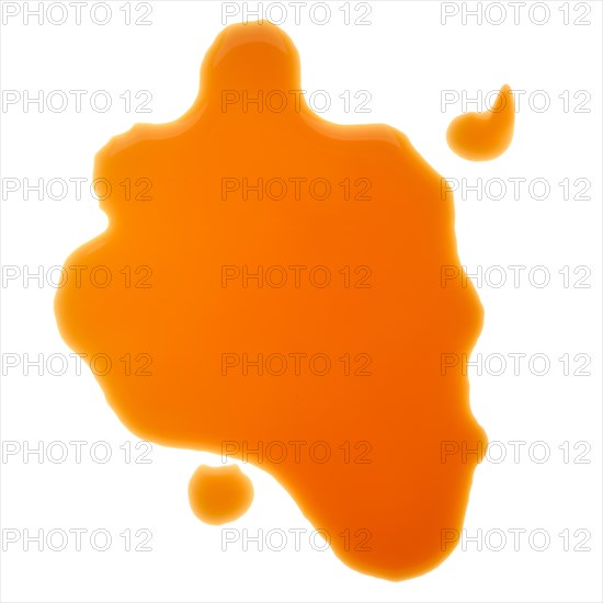 Overhead view of splash of balsamic vinegar on white background