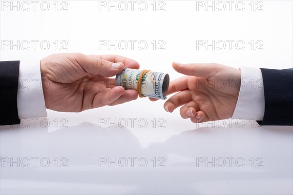 Businessman giving and receiving US dollar banknote money