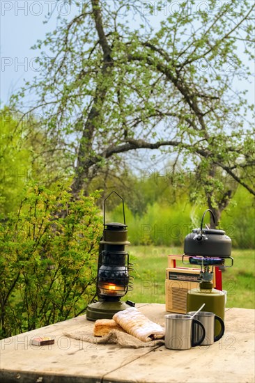 Snack outdoor in summer evening. Camping kettle