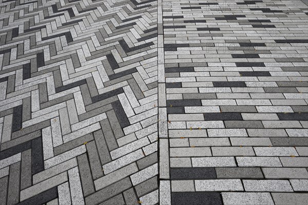 Creative structure with paving stones on sidewalk