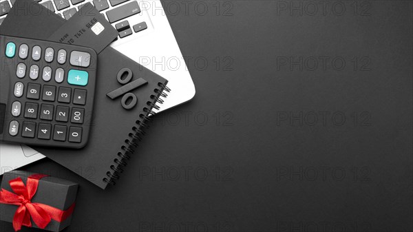 Flat lay black friday assortment on black background with copy space