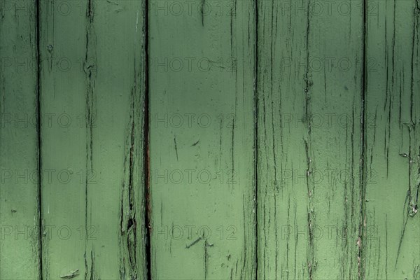 Abstract wooden background. Cracked paint on the wall