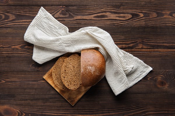 Top view of rue brown bread on cutting board