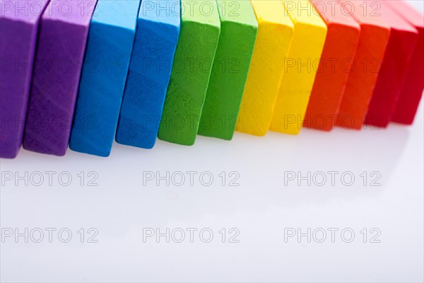 Colorful Domino Blocks in a line on a white background