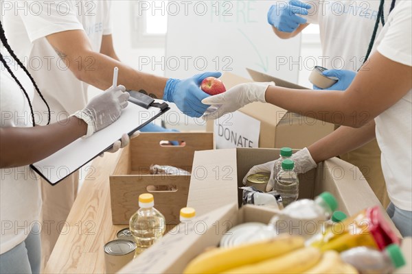 People volunteering together donating facility 1