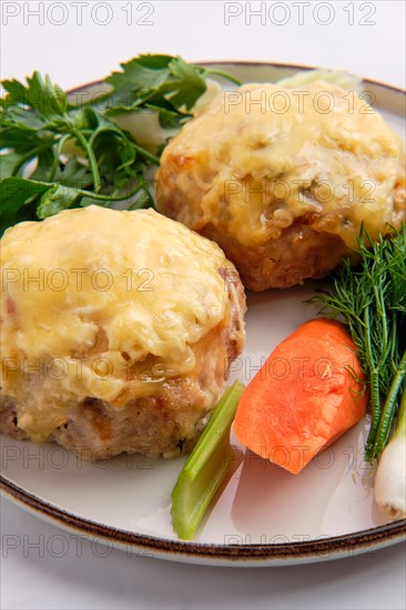 Cutlet covered with melted cheese served with fresh carrot