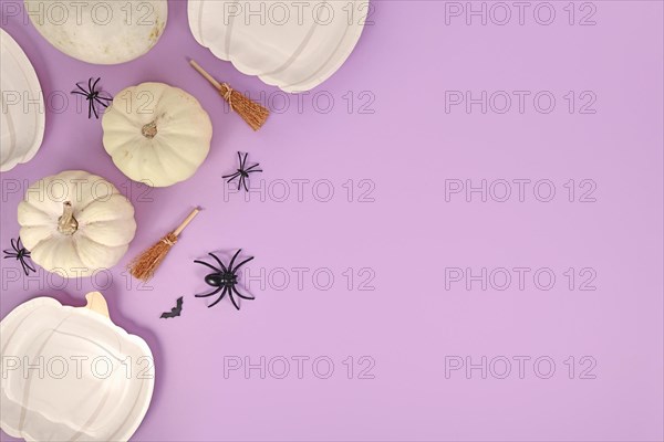 Halloween party flat lay with pumpkin shaped plates