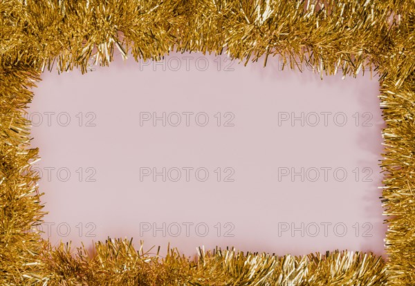 Golden tinsel frame with pink background