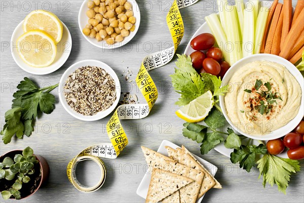 Top view hummus with assortment vegetables measuring tape. Resolution and high quality beautiful photo
