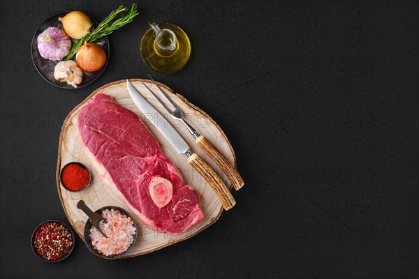 Overhead view of raw chuck eye steak isolated on white background