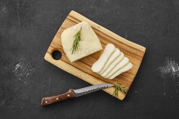 Homemade country style goat cheese on cutting board