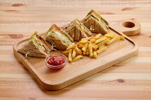 Club sandwich with american fries