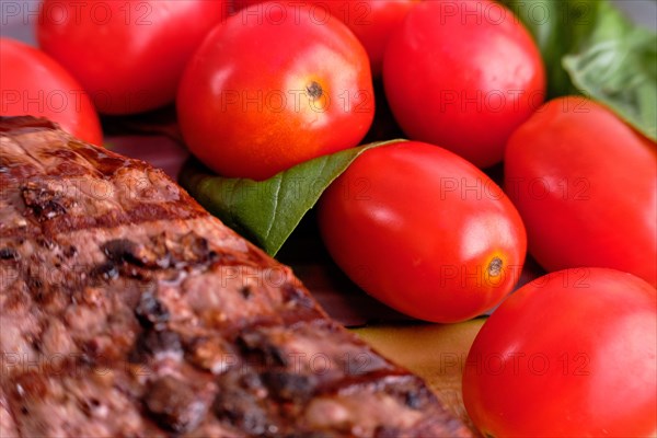 Macro photo of tomato cherry and steak