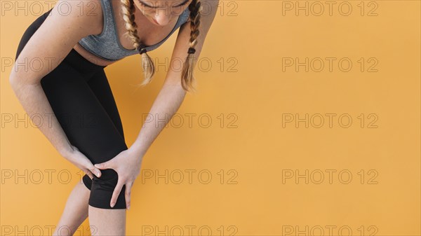 Woman sportswear touching hurting knee. Resolution and high quality beautiful photo