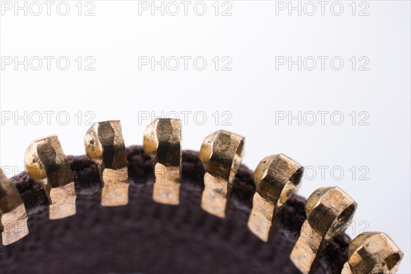 Close up or macro of a brown zipper on white background