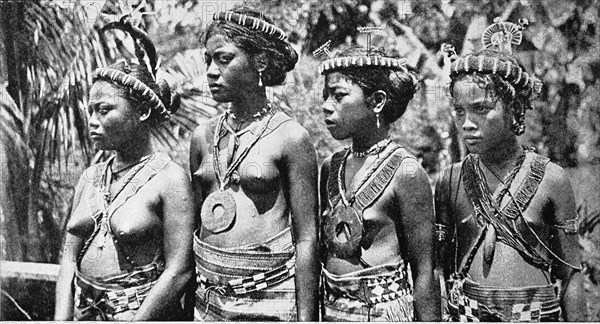 Girl from the Caroline Islands in dance jewellery. After the Spanish-American War