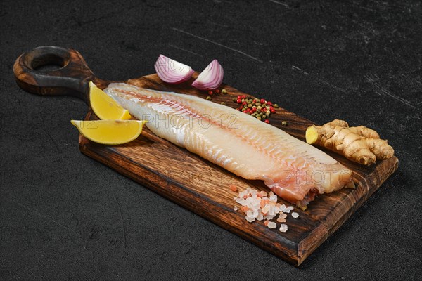 Frozen zander fillet on cutting board