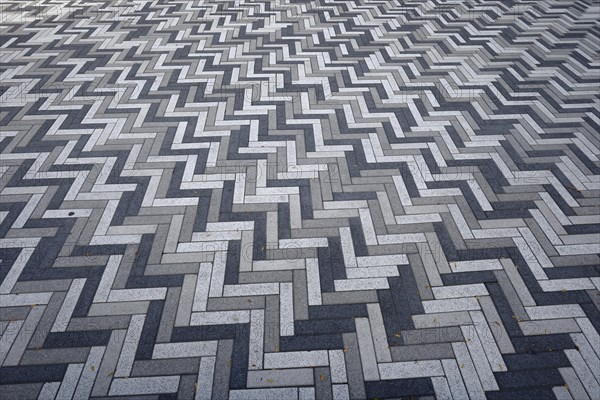 Creative structure with paving stones on sidewalk