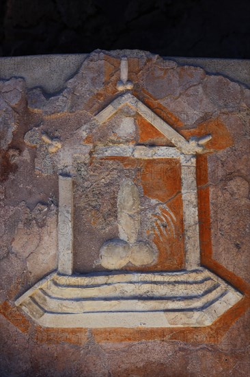 Stone relief of a penis as a reference to the brothel