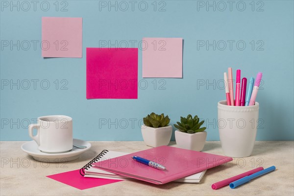 Desk arrangement with notebook pens