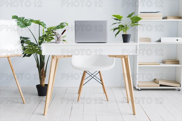 Office employee workspace with laptop table