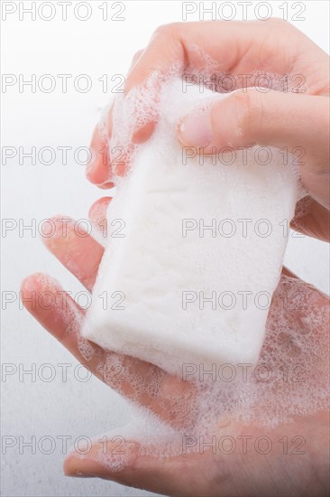 Hand washing and soap foam on a foamy background