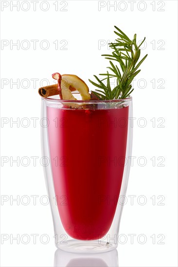 Hot cherry and apple winter drink with rosemary isolated on white