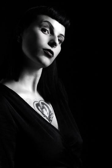 Portrait young woman with breast tattoo