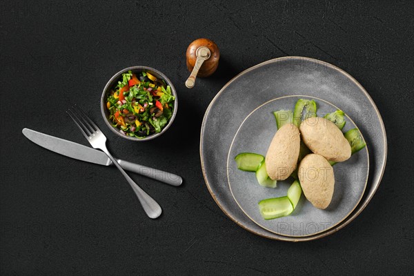 Top view of semifinished frozen cepelinai. Potato dumplings stuffed with ground meat