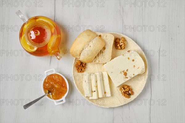 Healthy rustic breakfast. Top view of homemade curd cheese with raisin and walnut