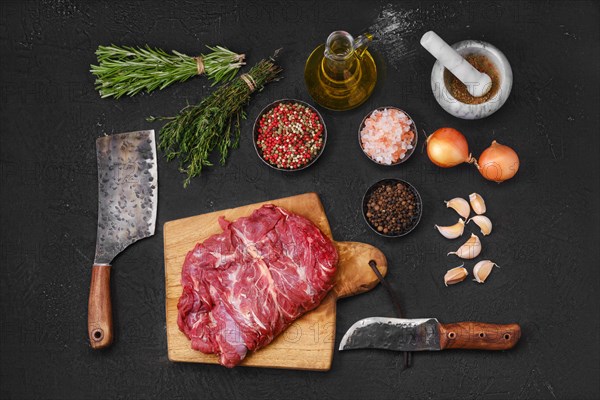 Overhead view of raw fresh lamb boneless neck meat on cutting board