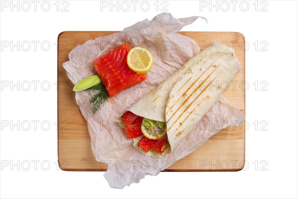 Top view of burrito with salmon and shallot isolated on white background
