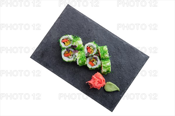 Set of rolls with seaweed chuka salad isolated on white background