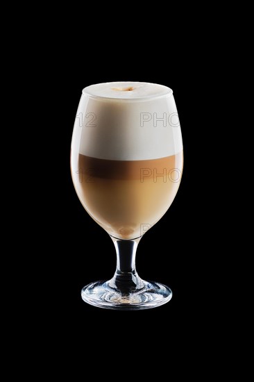 Big transparent glass with layered latte isolated on black background