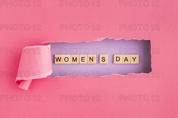 Women s day written in scrabble letters and torn paper. Resolution and high quality beautiful photo
