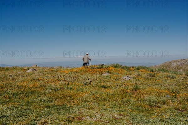 Hikers with backpacks and trekking poles walking in Turkish highland