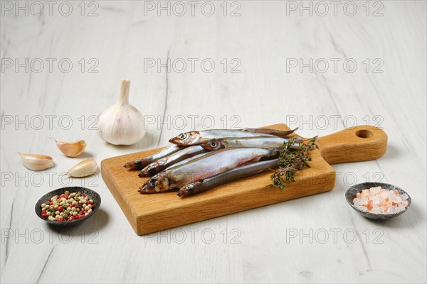 Pile of fresh raw frozen capelin