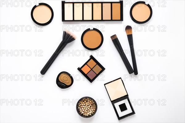 Different facial powders with powder brushes table