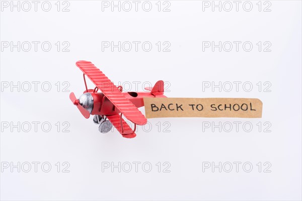 Little model plane carriying a back to school banner