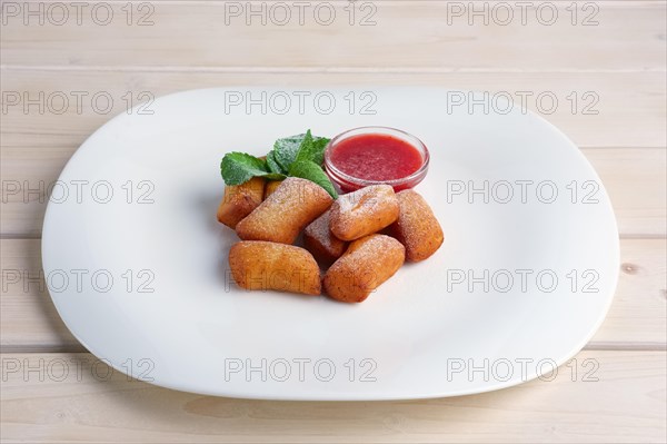 Curd bars with strawberry jam decorated with mint leaf