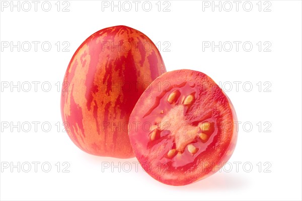 Fresh whole and one half tomatoes Trenton's tiger isolated on white background
