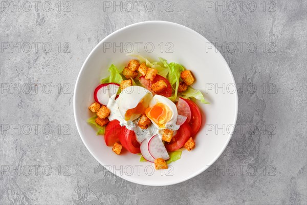 Top view of salad with fresh tomato